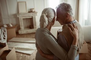 a man and woman hugging in a room