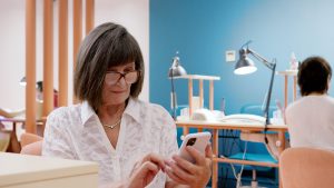 a woman holding a phone