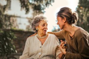 a woman holding a woman's shoulder