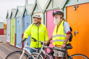 a man and woman with bikes