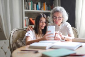 a woman taking a selfie with a young girl