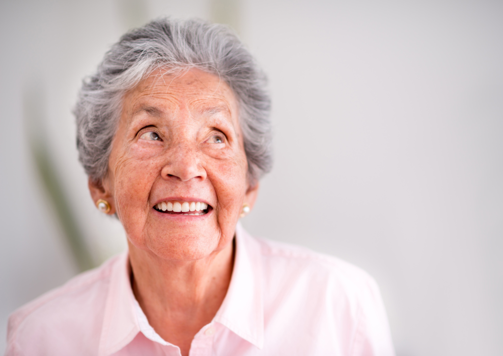 an elderly woman reveling in her newfound strength after availing senior mental health services