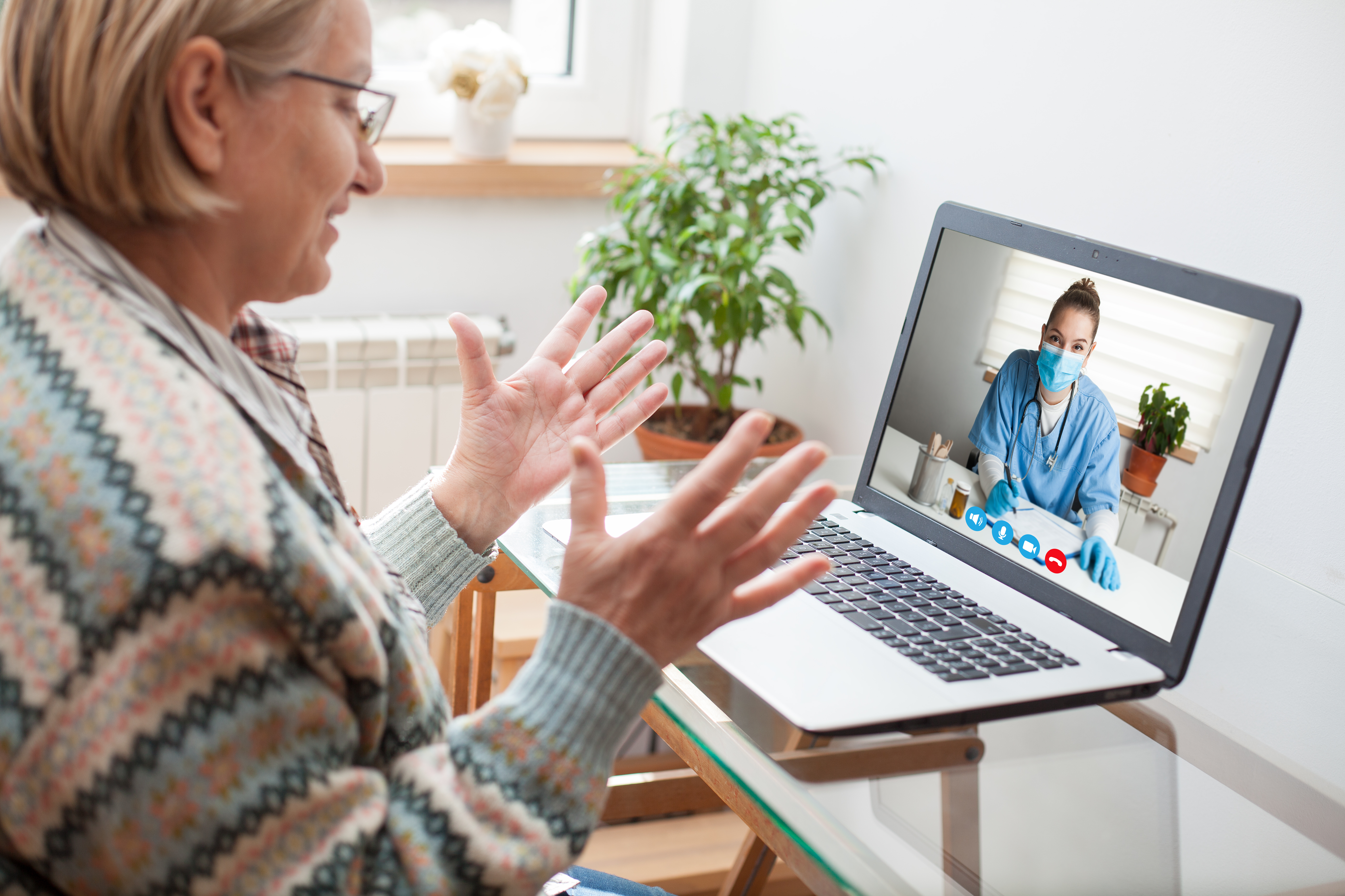 woman interacting with young female doctor
