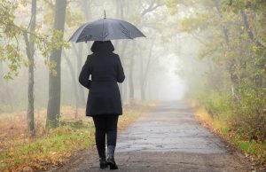 Woman with black umbrella