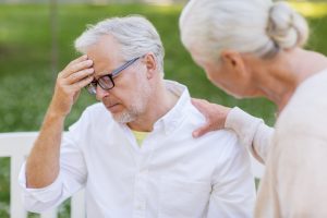 senior man holding head