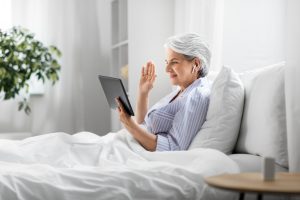 older woman with tablet