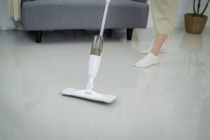 woman cleaning living room