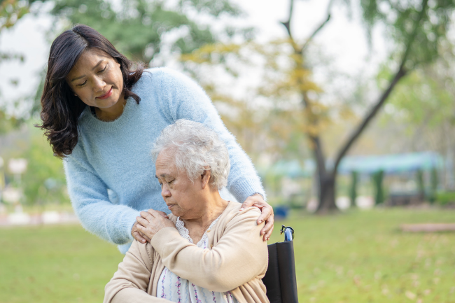 a woman holding a woman's shoulder, how to avoid compassion fatigue
